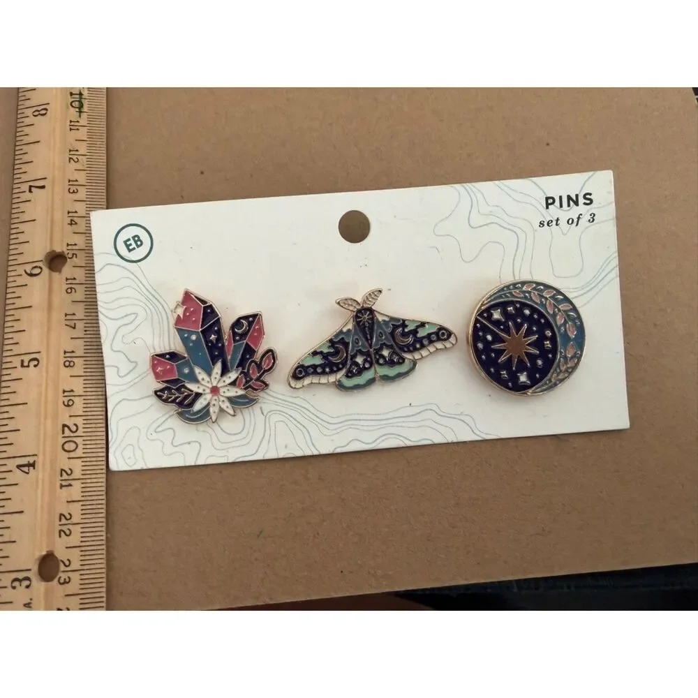 Set of 3 enamel pins featuring moth, crystal and celestial design